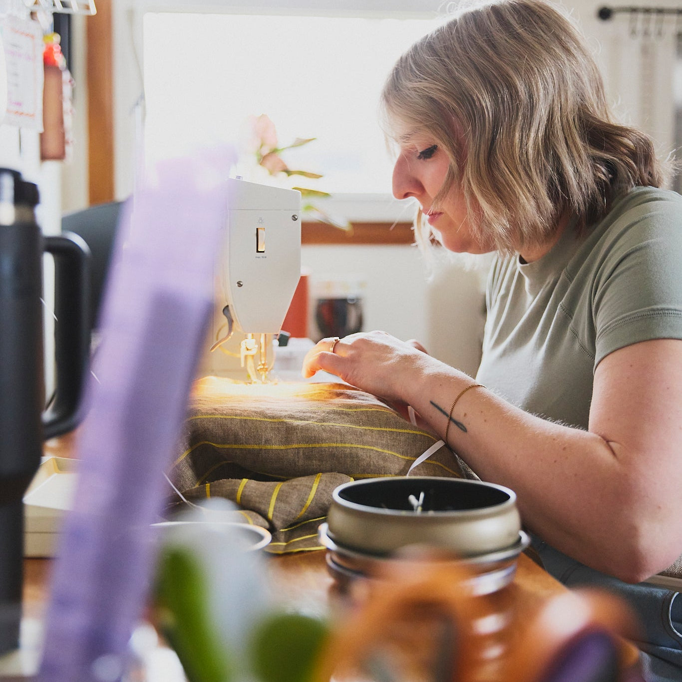 Ashton of ARW sewing a jacket in her home studio