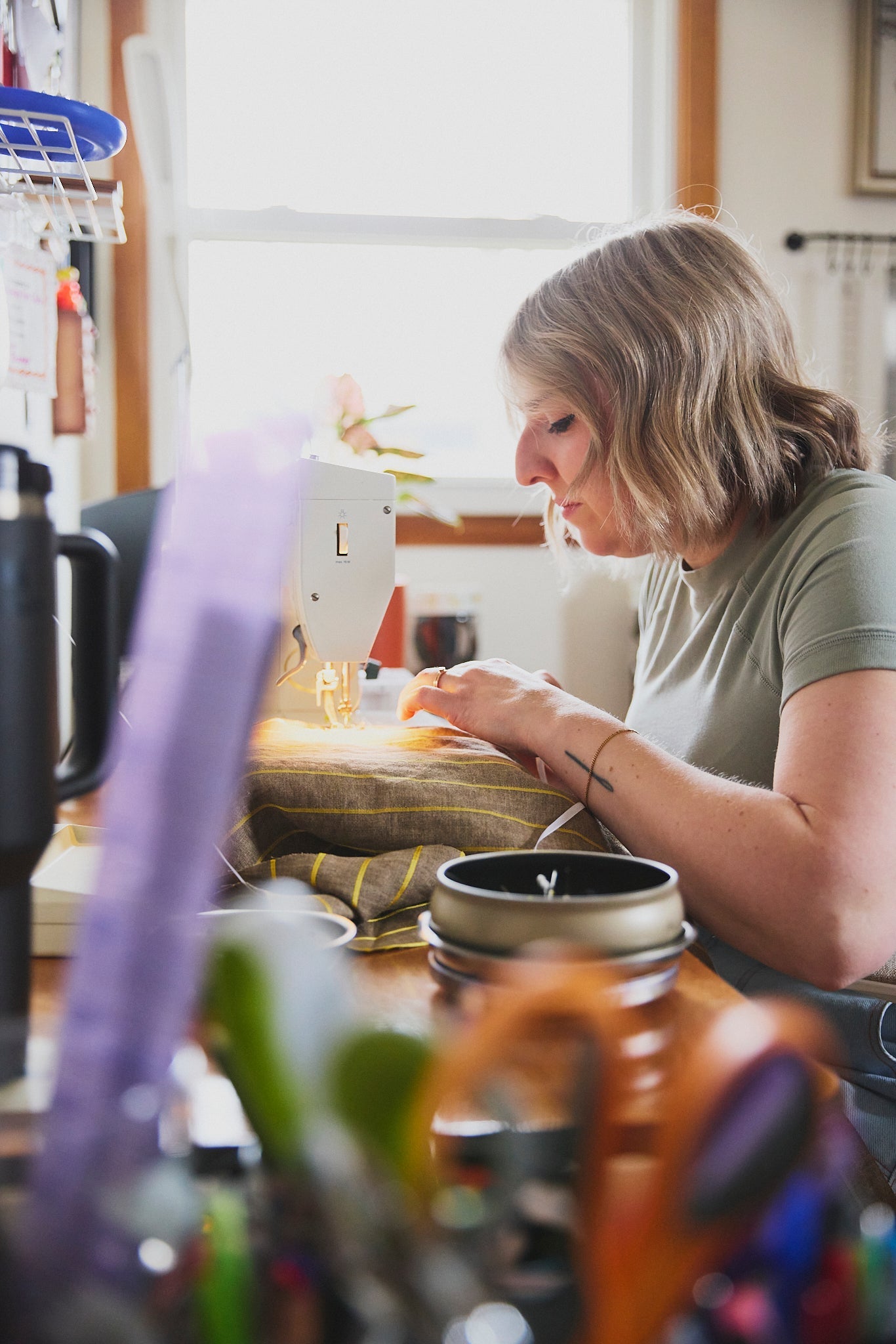 Ashton of ARW sewing a jacket in her home studio