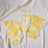 tumeric-dyed organic onesie 3-pack