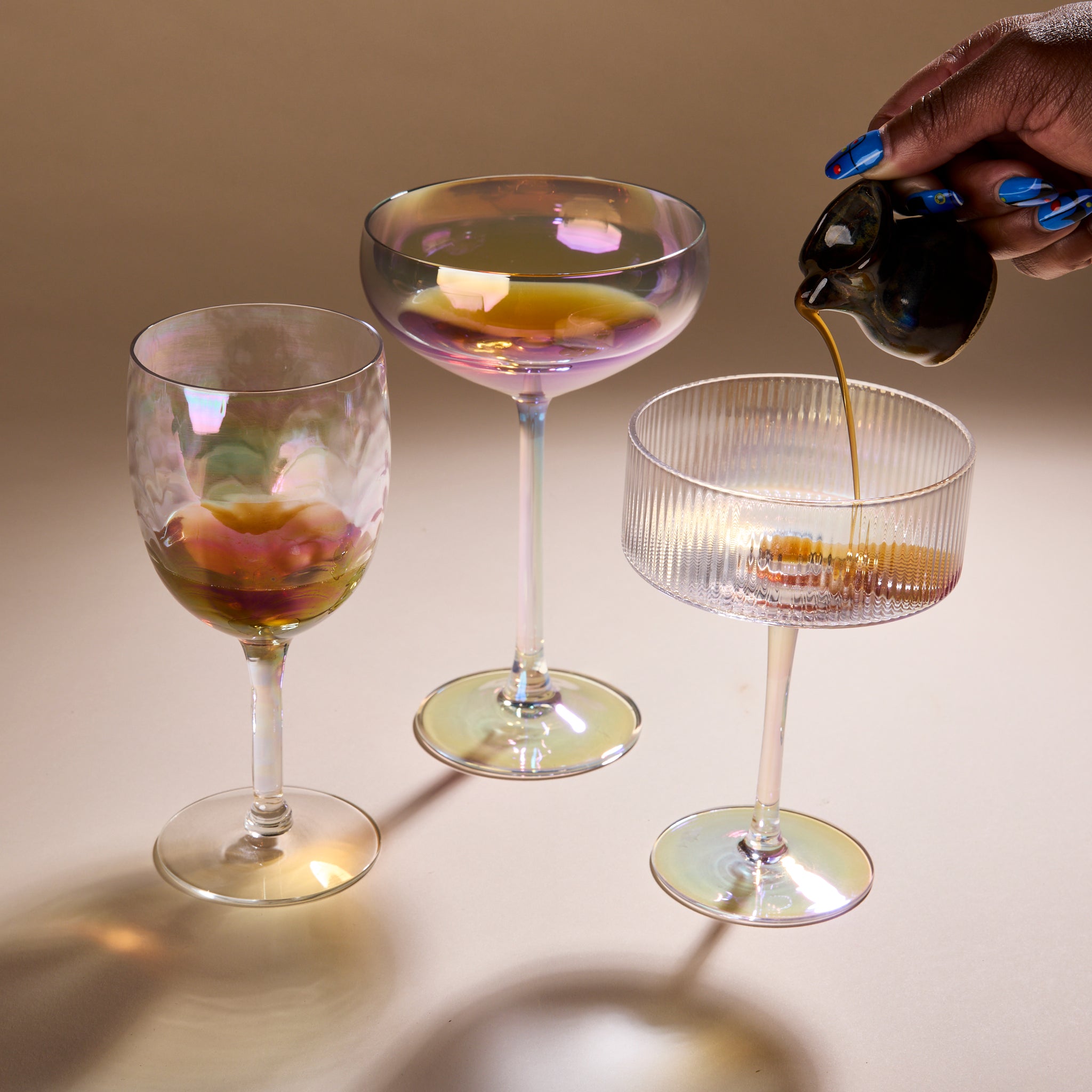 Cup of Communitea's tea infused simple syrups, each poured into cocktail glasses. 