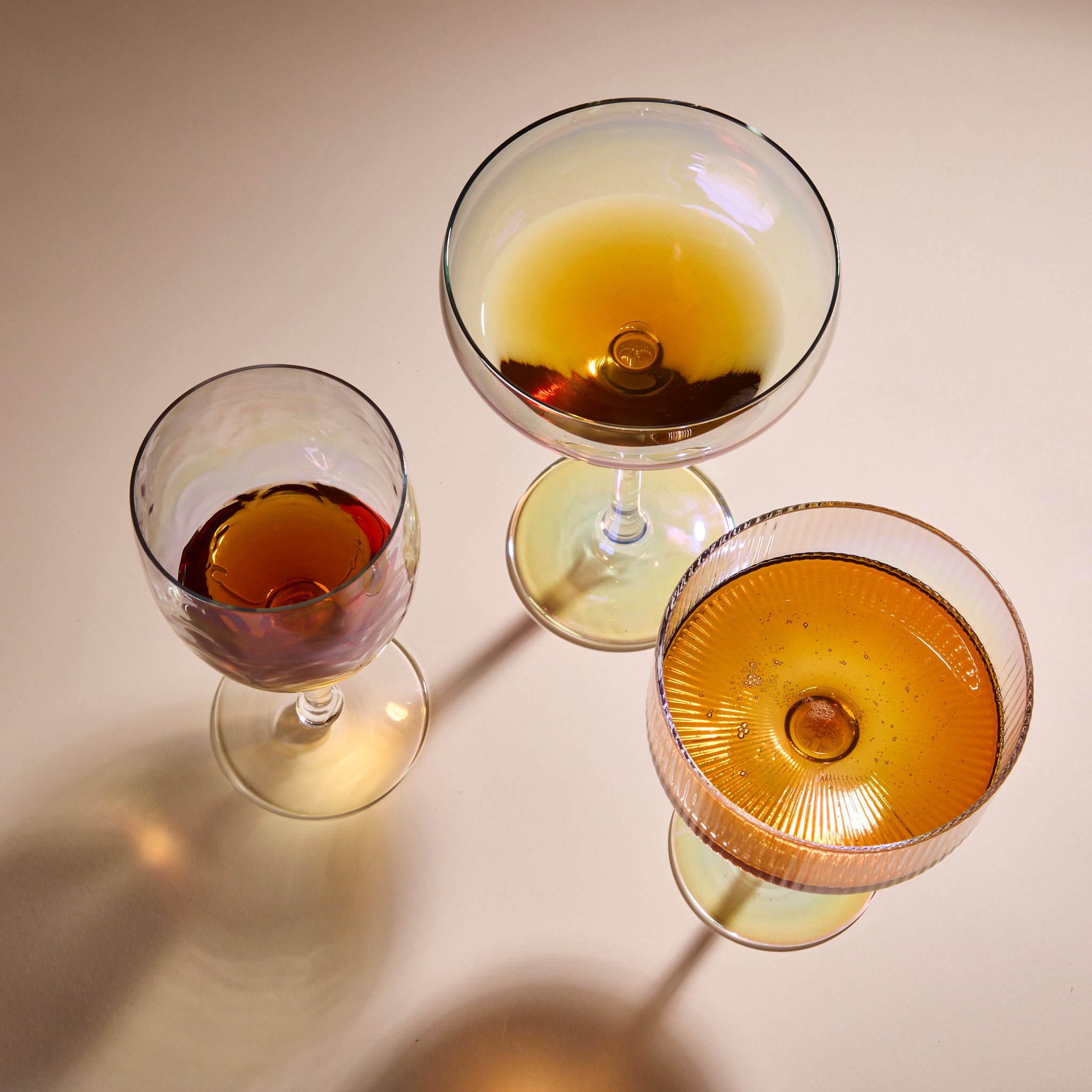 Cup of Communitea's tea infused simple syrups, each poured into cocktail glasses.  