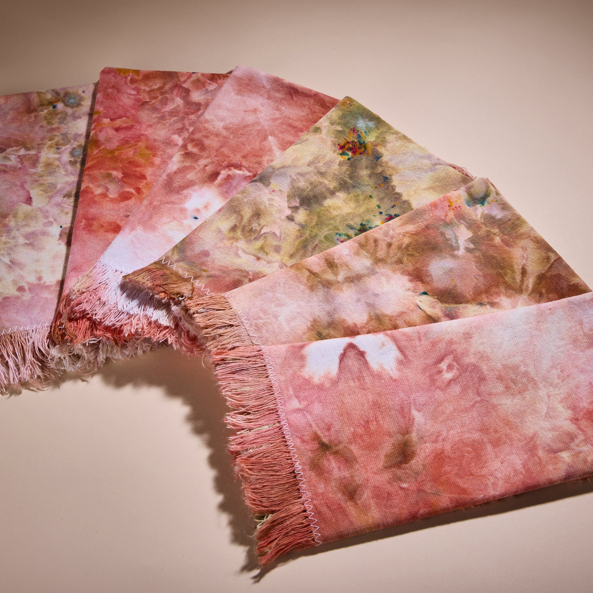 Six Goldy Way hand-dyed fabric napkins.