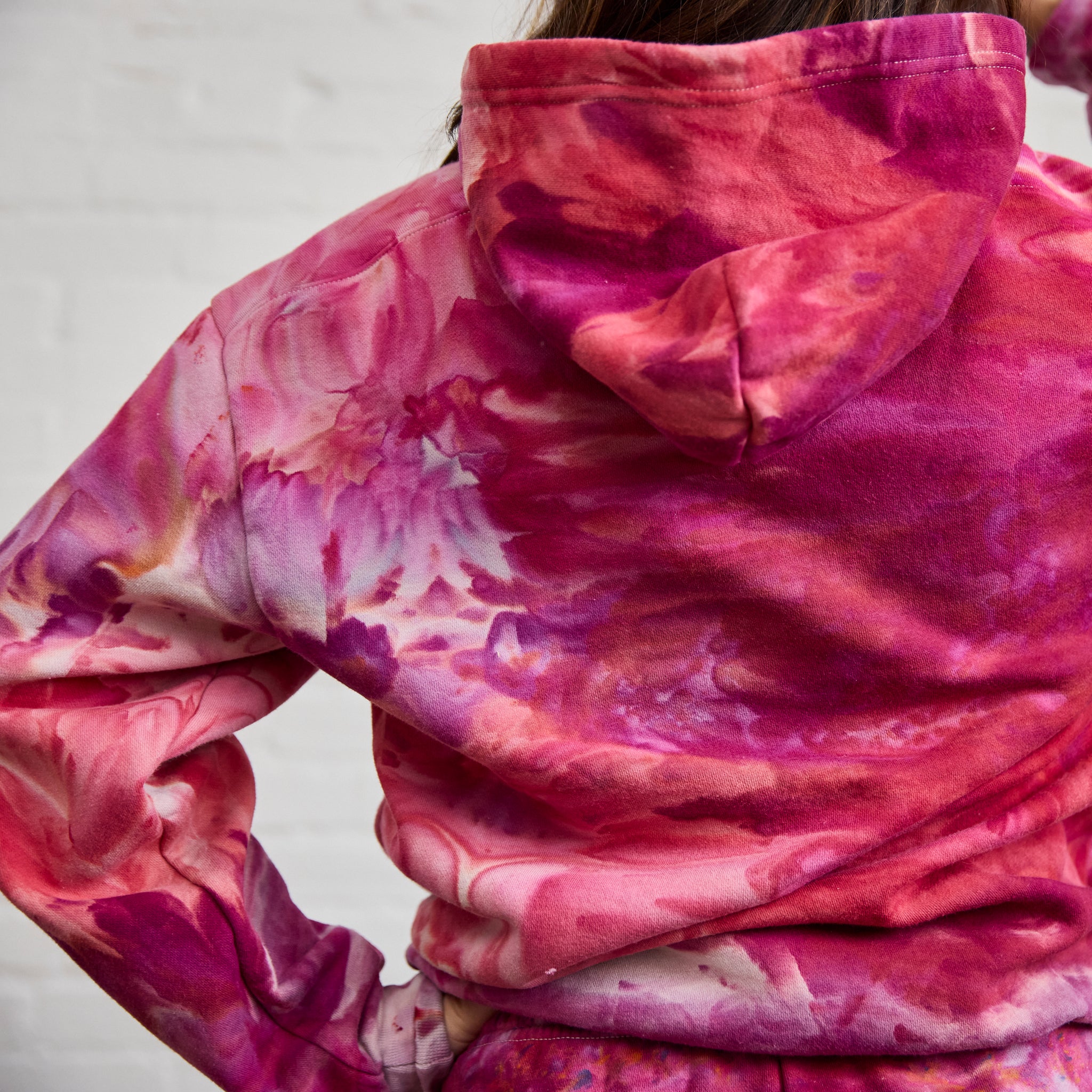 A closeup on the back of Goldy Way's ice-dyed sweatsuit, zoomed in on the back of the Winterberry version of the hoodie.