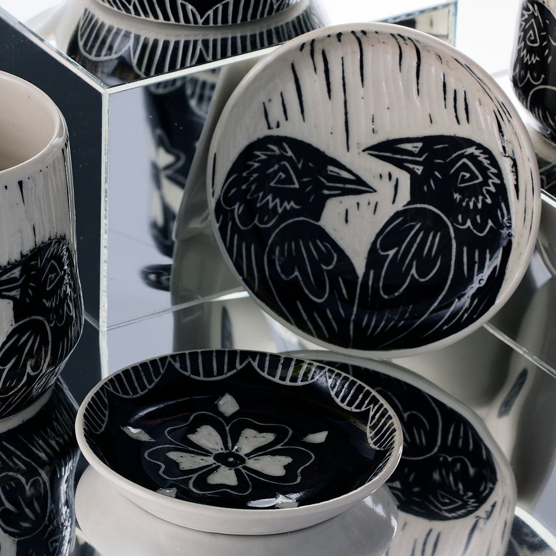handmade porcelain dish with raven and flower design
