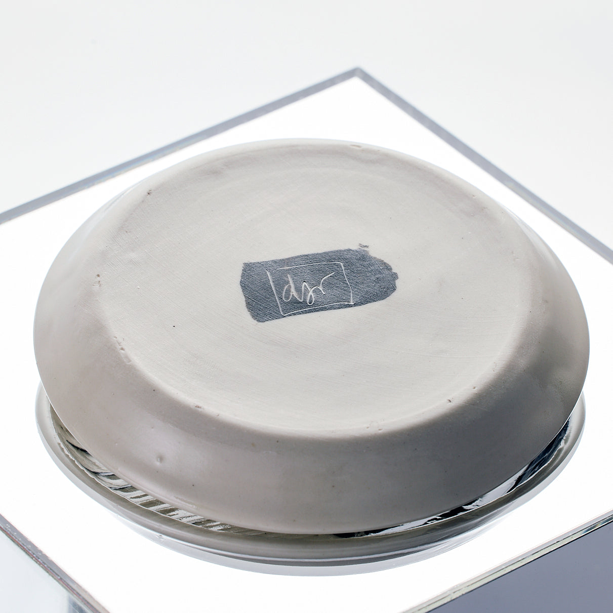 Artist signature on the bottom of porcelain dish