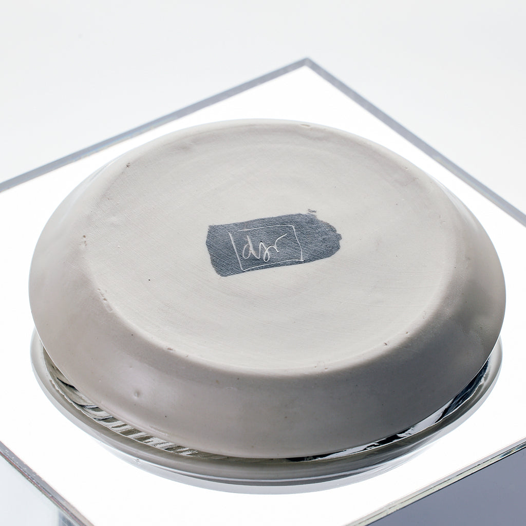 Artist signature on the bottom of porcelain dish