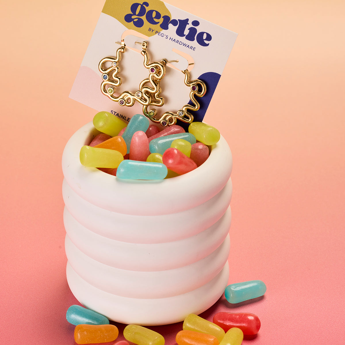 muse hoops from Gertie by Peg's Hardware. Gold hoops with colorful gems in candy