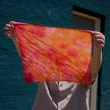 An orange ice-dyed bandana.