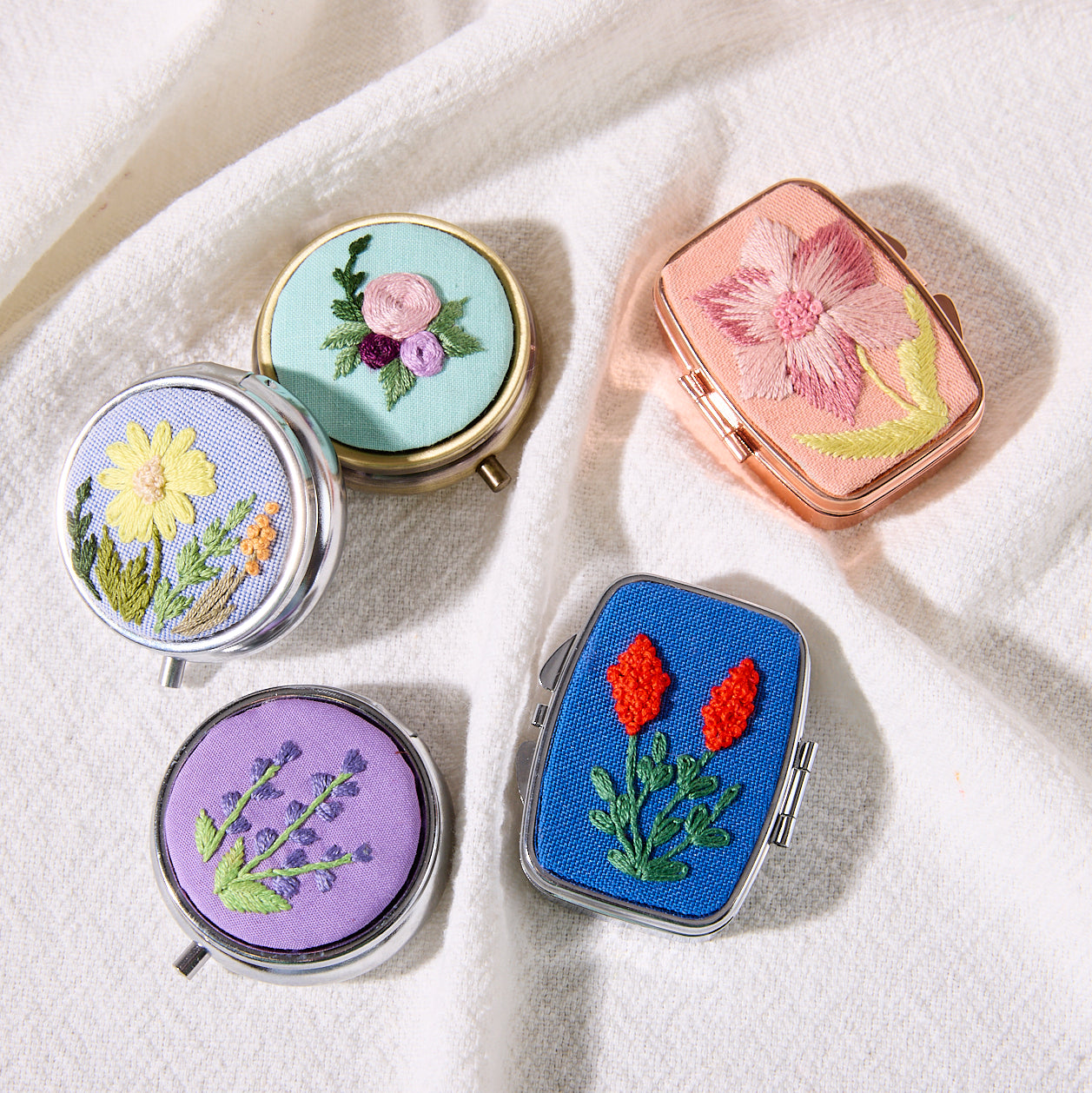 hand-embroidered pill cases